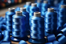 Several Spools Of Thread Arranged Neatly On A Table.