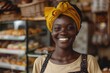 A woman with a yellow turban standing in front of a bakery. Suitable for food and culture concepts