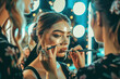 A team of professional makeup artists applying glamorous makeup looks on models in a chic beauty salon adorned with vanity mirrors.
