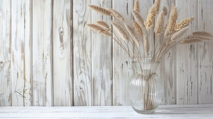Aufkleber - A vase filled with dry grass on a wooden table, suitable for interior design projects