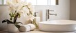 A bathroom sink with a vase of flowers, towels on the counter, and a plumbing fixture. The interior design includes cabinetry, a window, and house building features