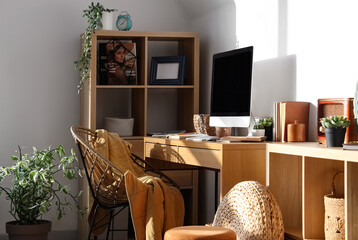 Sticker - Modern workplace with computer, shelving unit and chair in light office