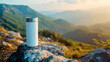 Blank white mockup reusable ECO tumbler, natural mountain range landscape blurred in the background. Steel and stainless bottle