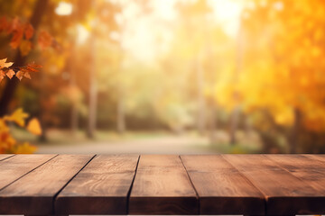 The empty wooden table top with blur background of autumn.