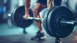 Fitness. A male lifts a heavy barbell. Blurred gym in the background. health care 