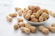A pile of peanuts in their shells, a staple food ingredient packed with nutrients and lots of protein