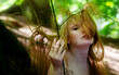 © ullision - Portrait of a young lovely sexy red haired woman redhead with seductive look whose hair is woven into the branches of the green forest