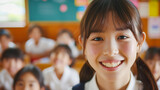 Fototapeta Zachód słońca - 教室で笑顔の小学校高学年の女の子