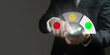 © Pheniti - A man is holding a cell phone and pointing to a happy face