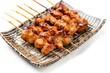 Yakitori served on a plate isolated on a white background
