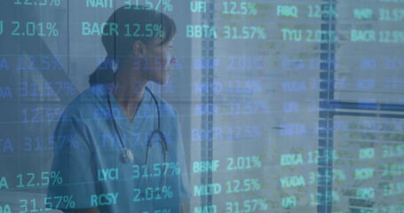 Canvas Print - Image of financial data processing over female doctor with stethoscope