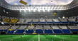 Image of falling gold confetti over football stadium