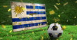 Image of confetti and flag of uruguay over football and stadium