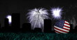 Image of fireworks and cityscape over ball with usa flag