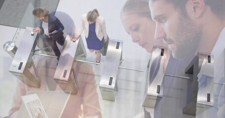 Poster - Image of diverse colleagues using laptops in office over commuters walking through turnstiles
