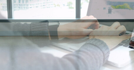 Poster - Image of hands using laptop over male and female colleague walking in modern building