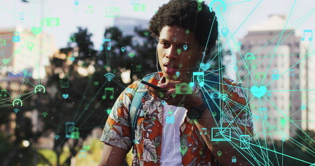 Poster - Image of media icons over african american man using smartphone