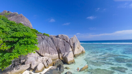 Wall Mural - Anse Source D'Argent Beach in La Digue, Seychelles. Aerial view of tropical coastline on a sunny day