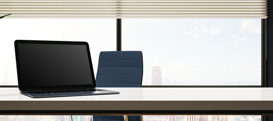 Poster - Creative wide designer desk with empty mock up laptop, supplies. Window with city view and blinds. 3D Rendering.