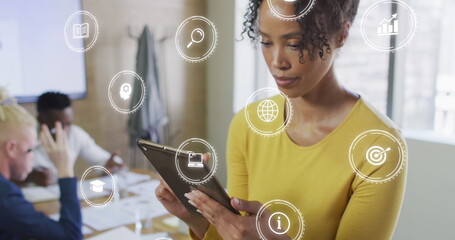 Canvas Print - Image of icons and data processing over biracial businesswoman in office