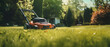 A lawn mower is being used to mow the grass panorama.