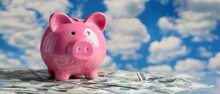 Pink Piggy Bank With Sky Background
