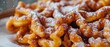 Spanish funnel cake with powdered sweetener and cinnamon topping Traditional Spanish treats