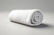 A white background showcases a soft towel made of terry cloth rolled up neatly