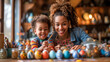 cute African American family painting Easter eggs at home. mother and son prepare for Easter