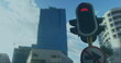 Image of scopes scanning and data processing on screens over traffic lights and cityscape