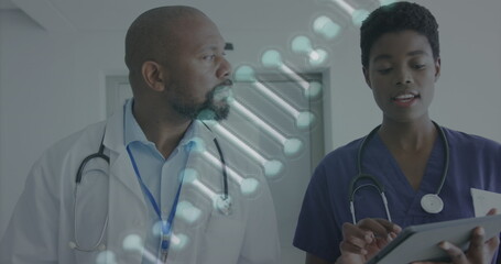 Poster - Image of dna strand over african american female and male doctor with tablet talking in hospital