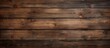 A close up of a brown hardwood plank wall with a beige wood stain, showcasing a beautiful pattern of rectangles and plywood flooring in the background