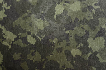 Wall Mural - texture of military dirty camouflage fabric. combat protective camouflage for background