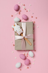 Sticker - Chocolate eggs with gifts on a pink background