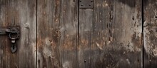 A Close Up Of A Hardwood Grey Wooden Door With A Chain On It, Set Against A Backdrop Of Green Grass. The Doors Plank Pattern And Metal Facade Add A Touch Of Elegance And Mystery