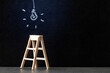 Wooden ladder with glowing light bulb drawn with chalk on blackboard, concept of new ideas, innovations and solutions in business