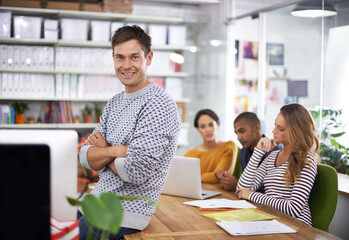 Poster - Designer, portrait and man in meeting with arms crossed for confidence, pride and happiness for startup company. Entrepreneur, employee or face with smile in coworking office for teamwork or planning