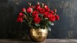 A lavish gold vase holds a profusion of vibrant red roses on a sleek table