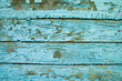 Old wooden surface with cracked blue paint