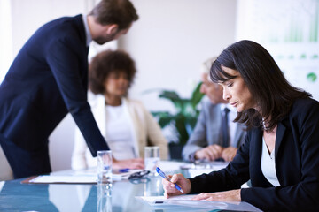 Wall Mural - Woman, reading or paper in business, meeting or planning to work, company or strategy in teamwork. Businesswoman, colleague or team in conference room as professional, collaboration or diversity