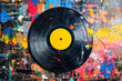 Record has yellow center and is surrounded by multicolored splatters of paint.
