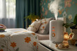 Air humidifier with steam stands on the bedside table in the children's room, green wall, bed with flowers. Concept aromatherapy and relaxing. Air freshener. Health concept of drying and moisture.