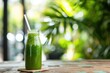 A refreshing green smoothie made with fresh ingredients, served in a glass with a straw, A refreshing green juice in a reusable glass bottle with a straw, AI Generated
