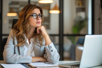 Poster - A professional woman focused on her work while sitting at a desk with a laptop computer, Serious female executive contemplating at her desk, AI Generated