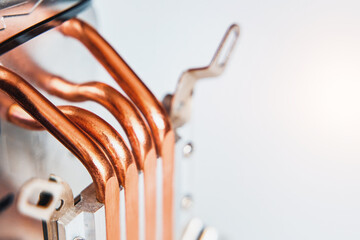 Close-up of an aluminum radiator with copper heat pipes isolated. Clean Copper Tubing Ready for Heat transfer.