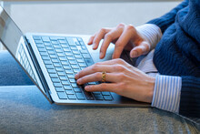Closeup Of Hands Typing On A Laptop Keyboard