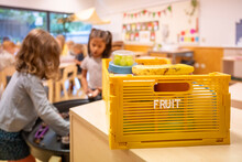 Children engaging in playtime activities in a bright classroom setting