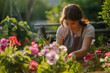 Close-Up of Woman Gardening in Sunlight. Adult woman tenderly caring for garden flowers, ideal for lifestyle or hobby themes.