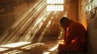 man in orange suit inside prison sitting repentant with rays of sun coming through the grate in high resolution and high quality. concept prisoner, prison, sorry, cry