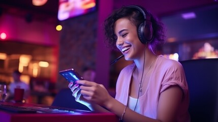 Poster - A happy Young beautiful female streamer, a gamer is playing a video game with a smartphone in a game room with neon Lighting. Cyber Sports, Esports, Hobbies and Entertainment concepts.